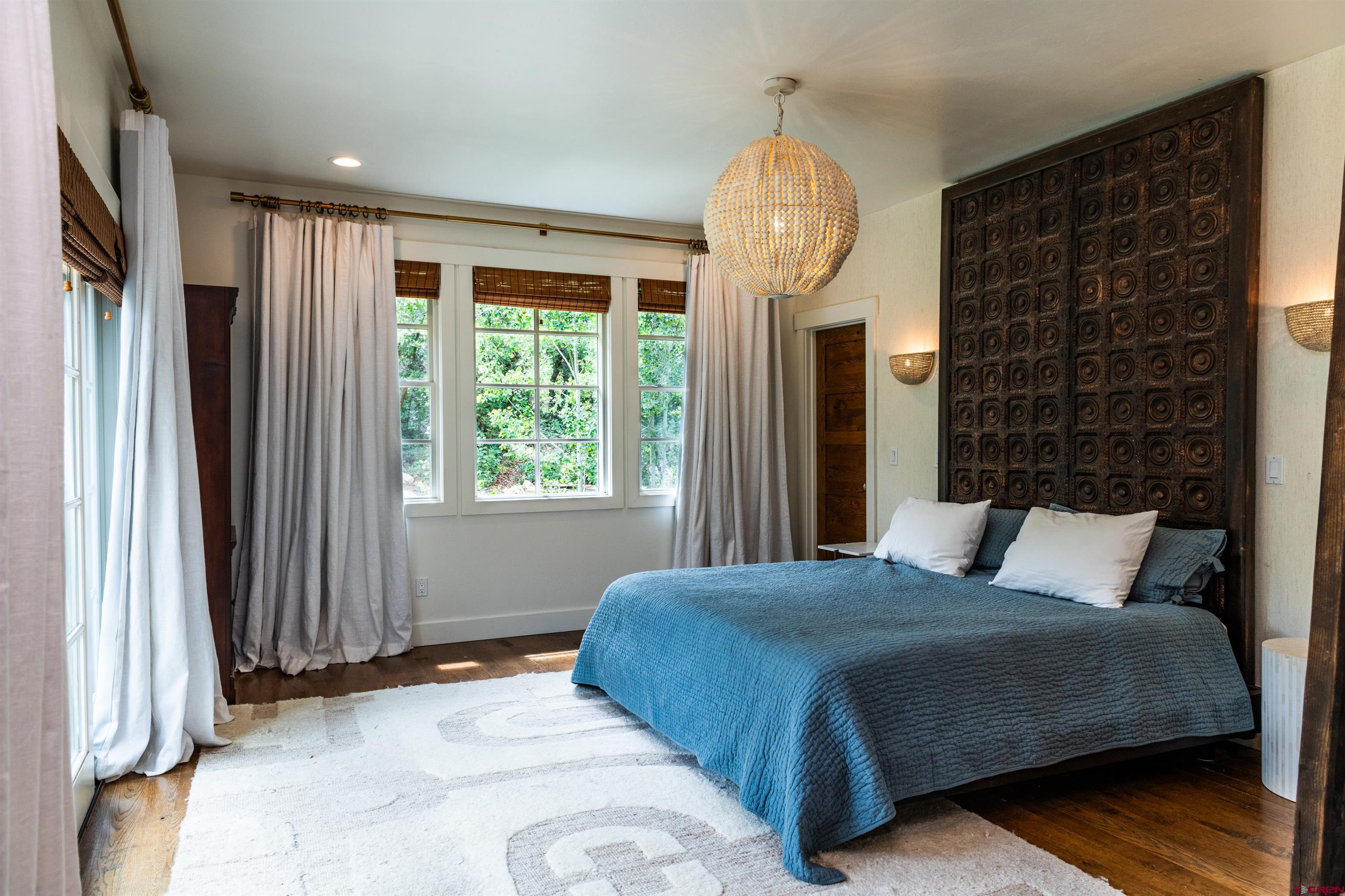 22 Kennebec Drive Durango, CO 81301 - Photo 15 of 34 a bedroom with a bed and a mirror