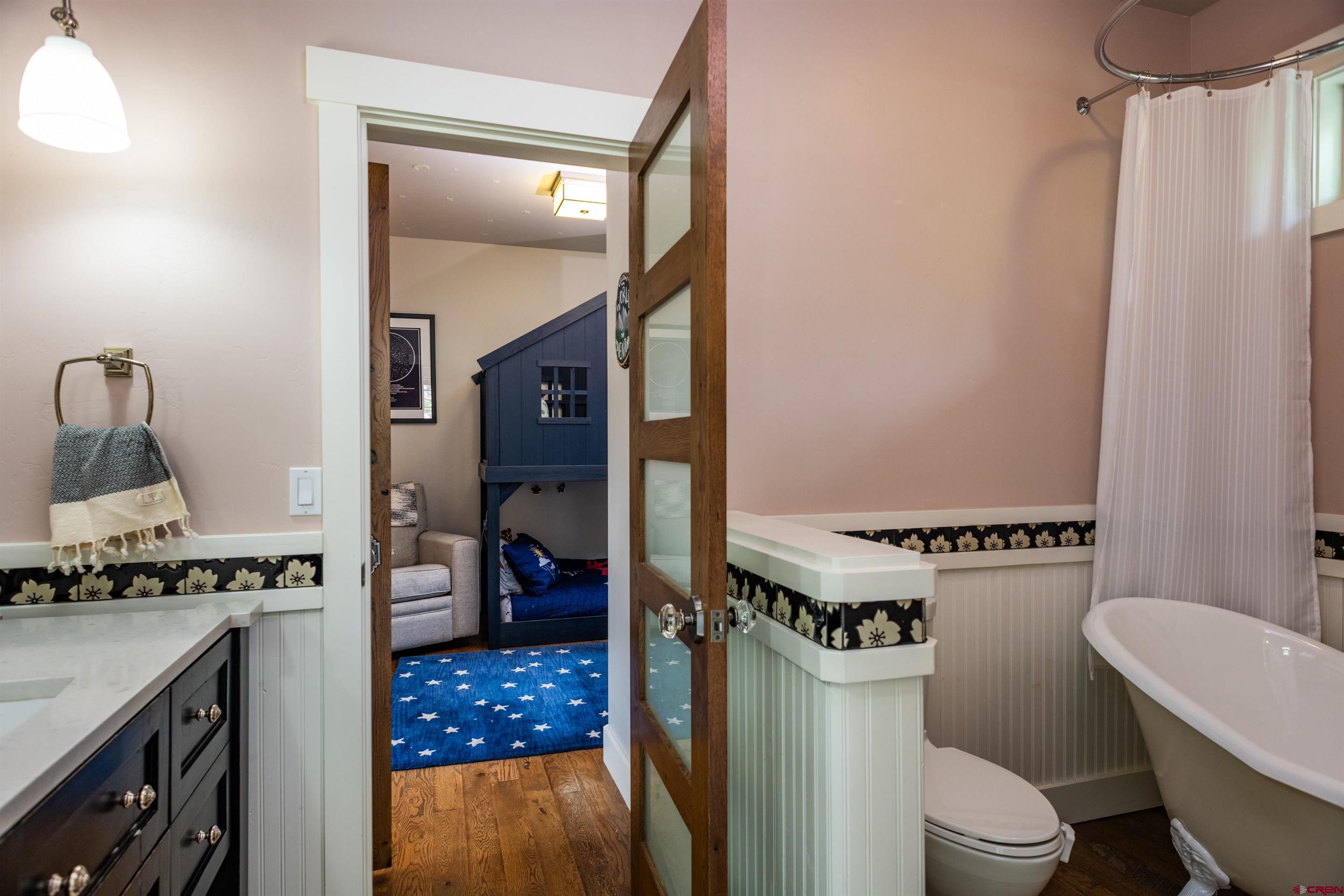 22 Kennebec Drive Durango, CO 81301 - Photo 20 of 34 a bathroom with a granite countertop toilet sink and mirror