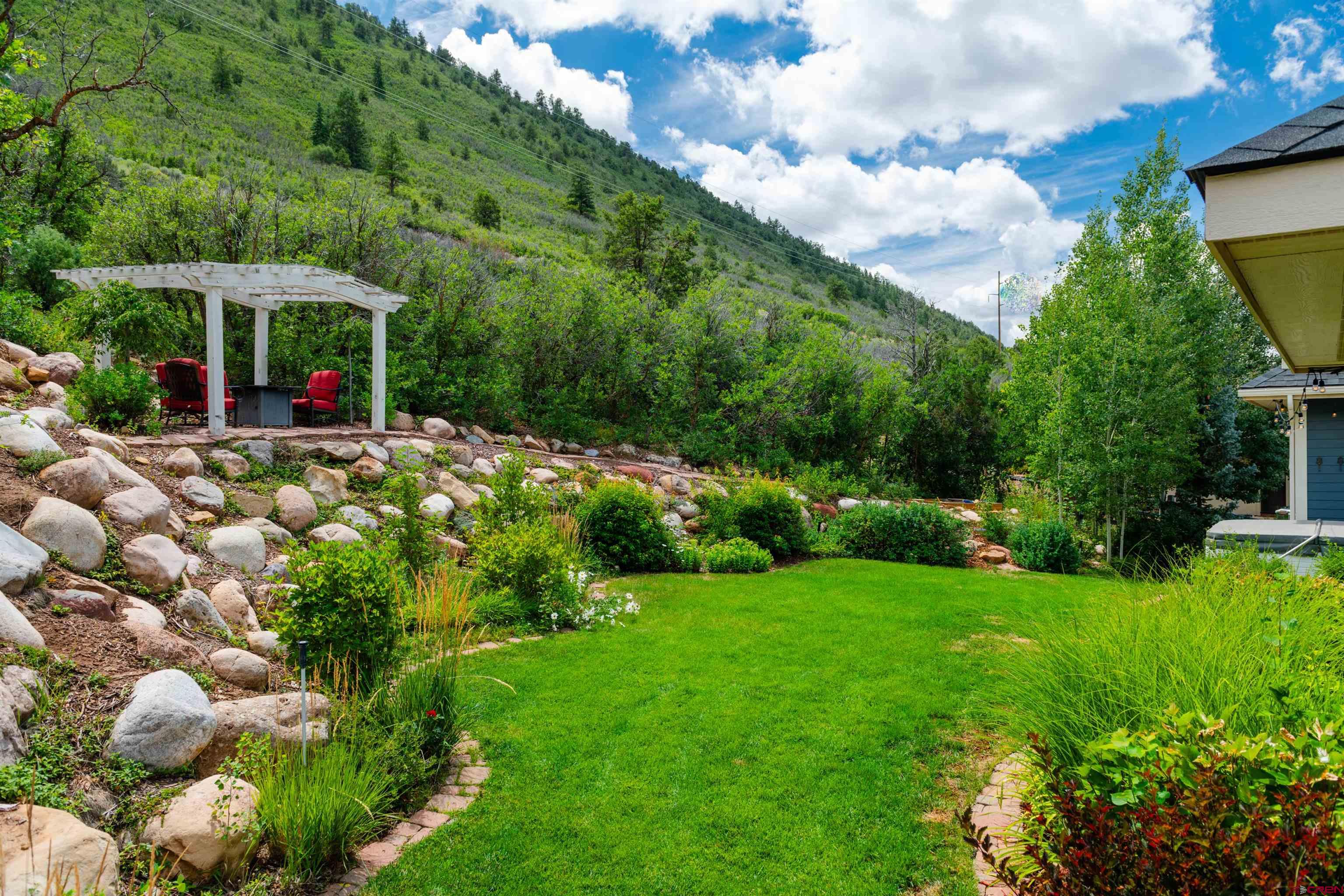 22 Kennebec Drive Durango, CO 81301 - Photo 30 of 34 a view of a house with a garden