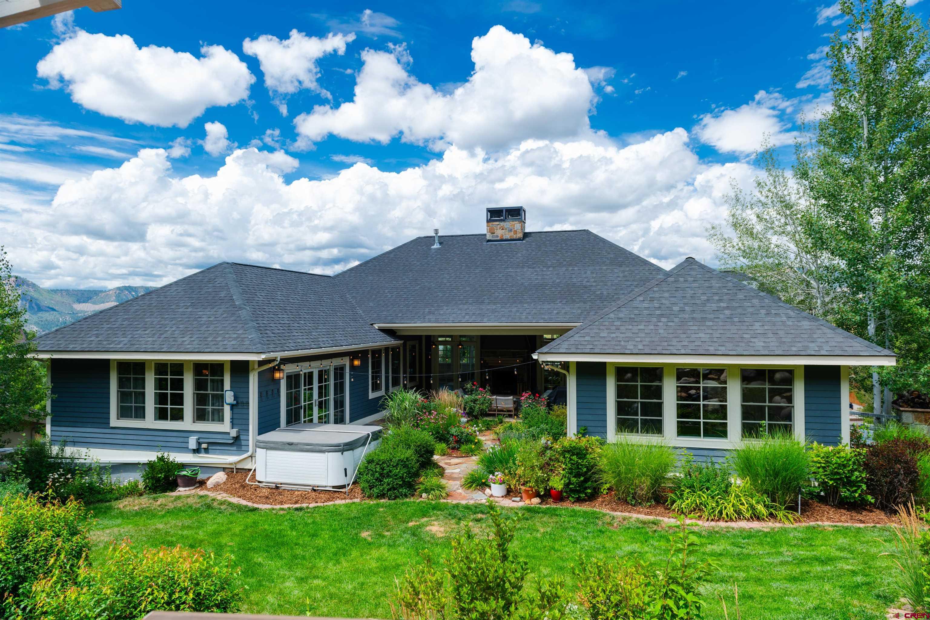 22 Kennebec Drive Durango, CO 81301 - Photo 33 of 34 a front view of a house with a yard and potted plants