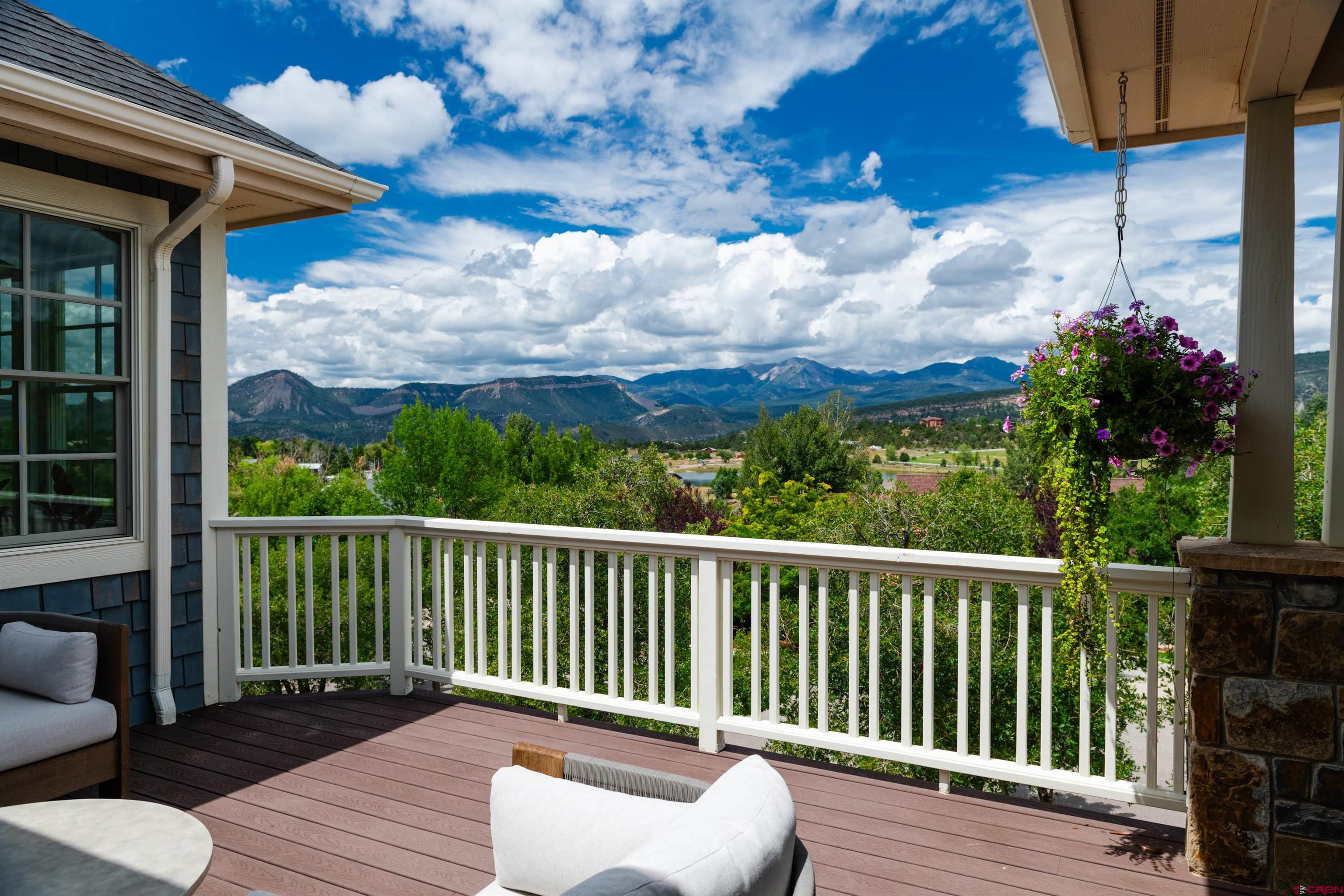 22 Kennebec Drive Durango, CO 81301 - Photo 5 of 34 a balcony with wooden floor table and chairs