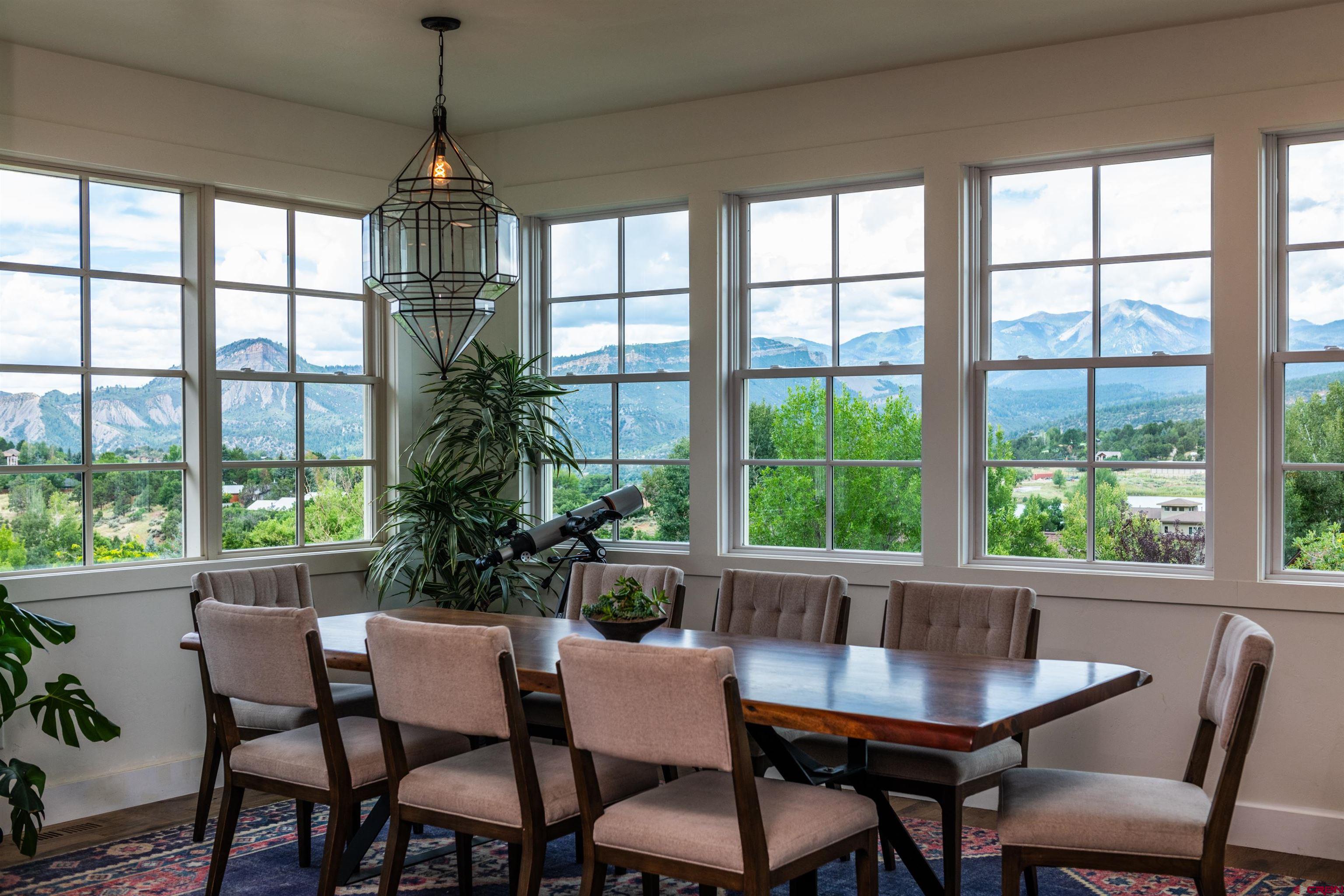 22 Kennebec Drive Durango, CO 81301 - Photo 9 of 34 a dining room with furniture a chandelier and wooden floor