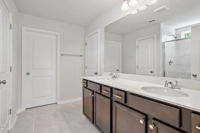 a view of swimming pool with seating space and yard in the back