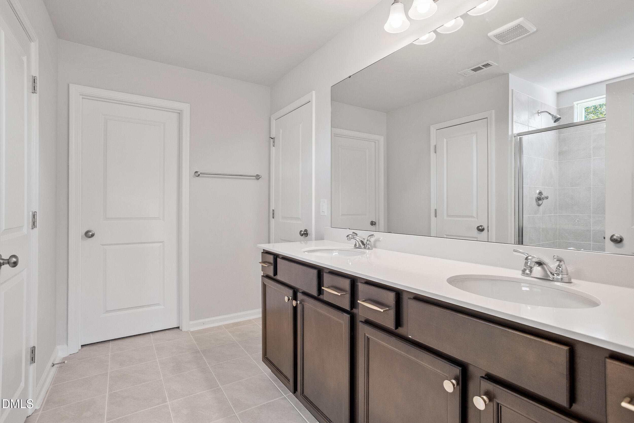 248 Alice Trace Place Angier, NC 27501 - Photo 20 of 32 a bathroom with a sink double vanity and a mirror