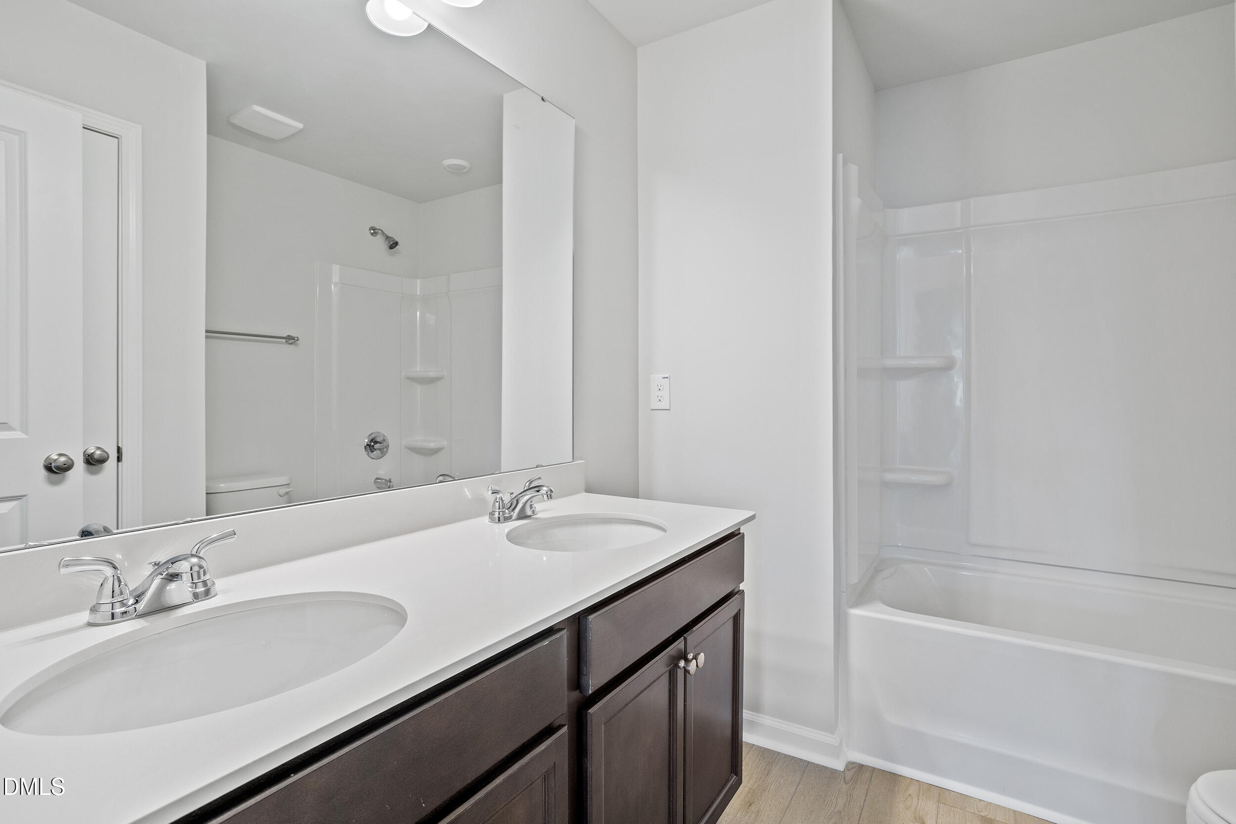 248 Alice Trace Place Angier, NC 27501 - Photo 26 of 32 a bathroom with a tub sink double and mirror