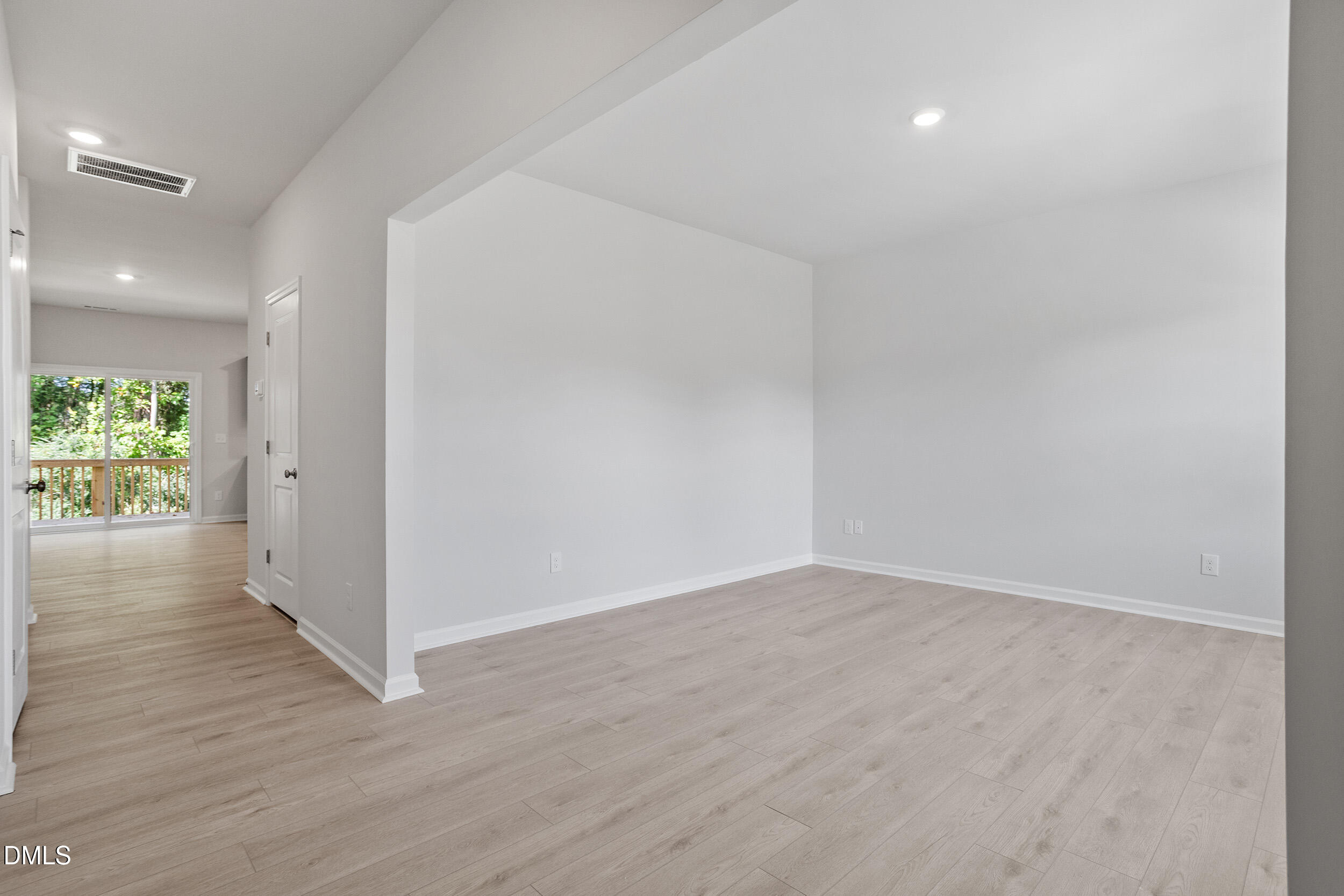 248 Alice Trace Place Angier, NC 27501 - Photo 2 of 32 an empty room with wooden floor and windows