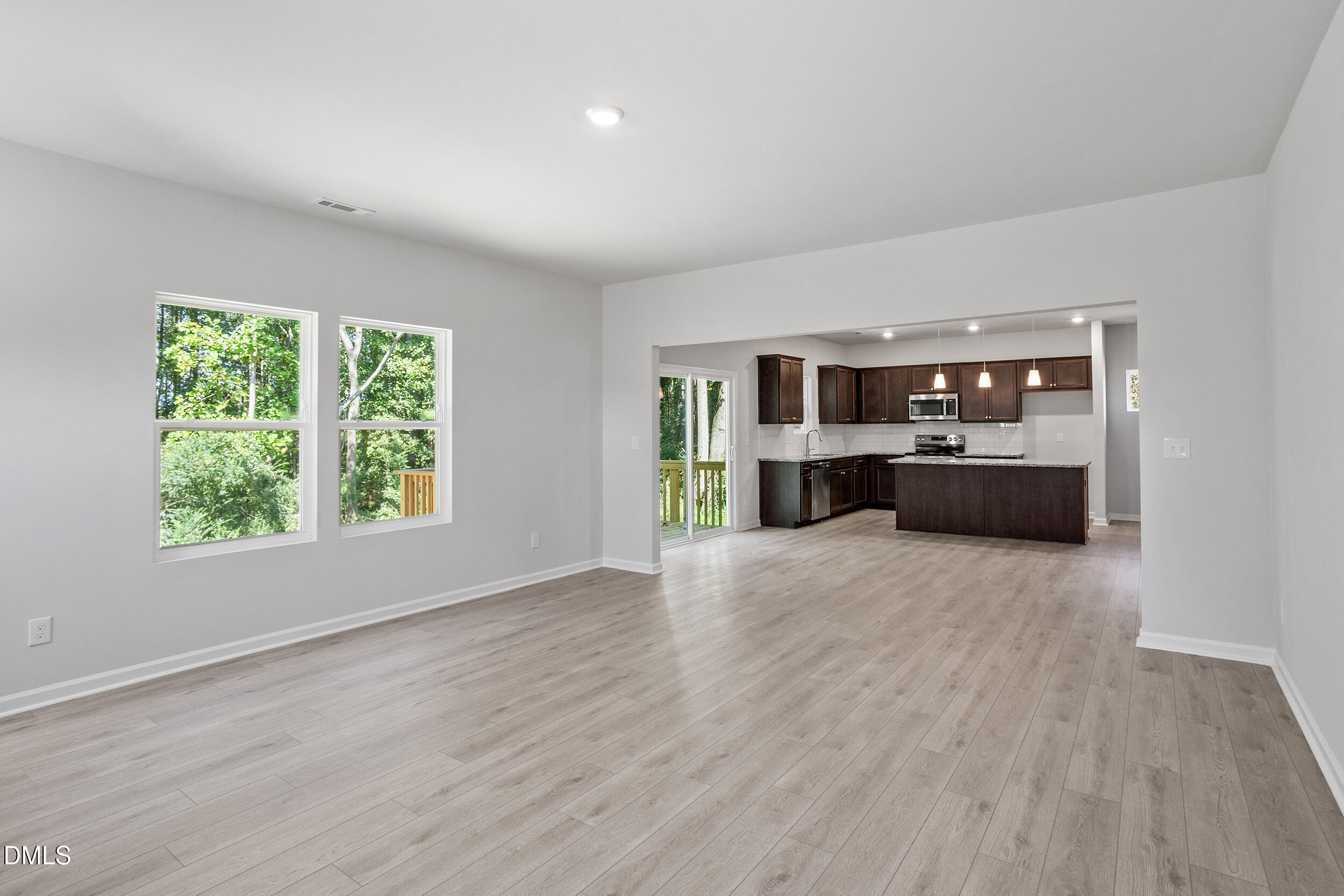 248 Alice Trace Place Angier, NC 27501 - Photo 7 of 32 a big room with wooden floor and windows
