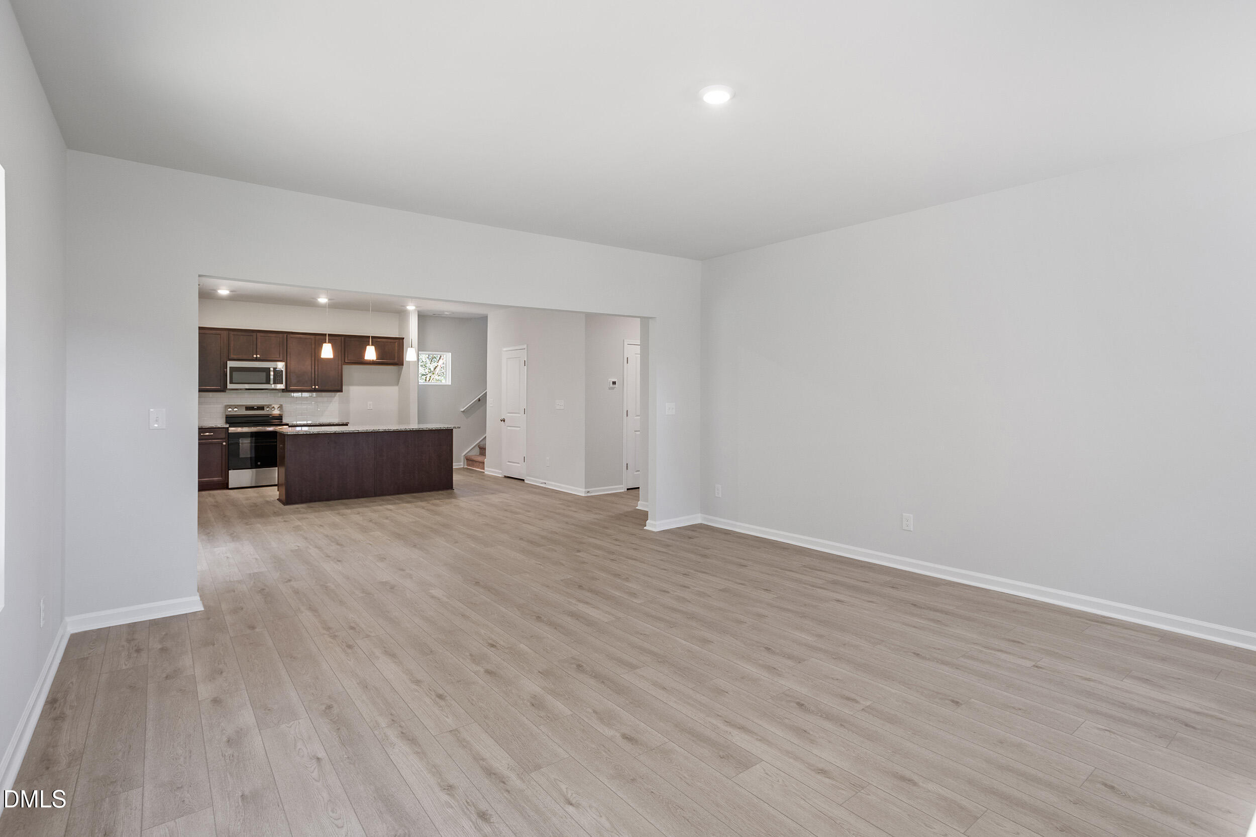 248 Alice Trace Place Angier, NC 27501 - Photo 8 of 32 a big room with wooden floor and windows