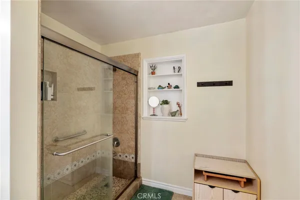 a bathroom with a shower and a sink