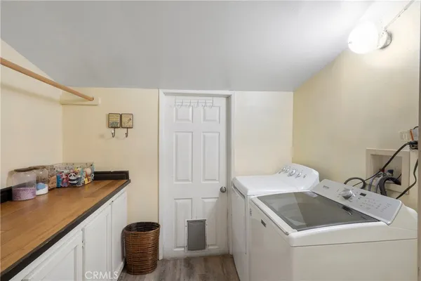 a utility room with a sink dryer and washer