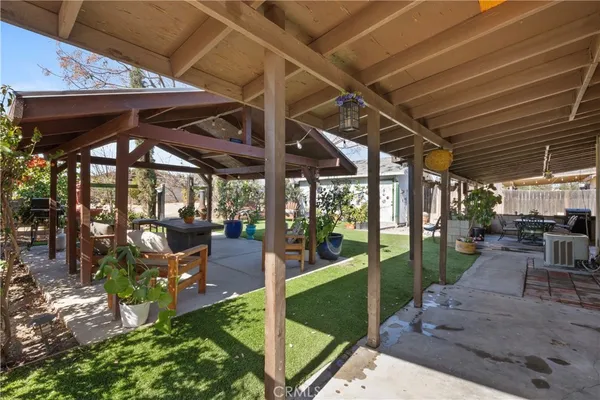 a view of a backyard with sitting area