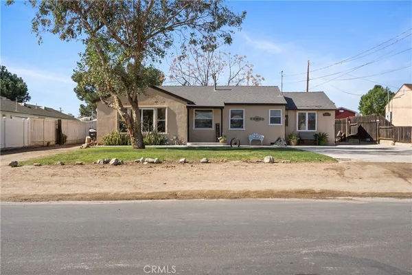 front view of a house with a road
