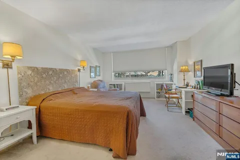 a bed room with a bed and a couch