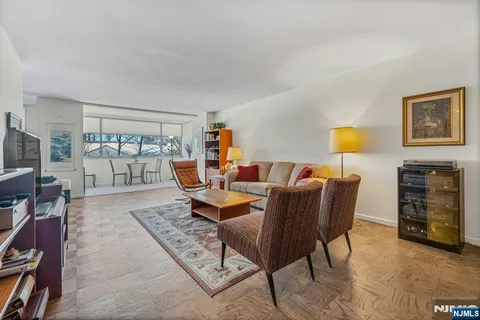 a dining area with furniture and window