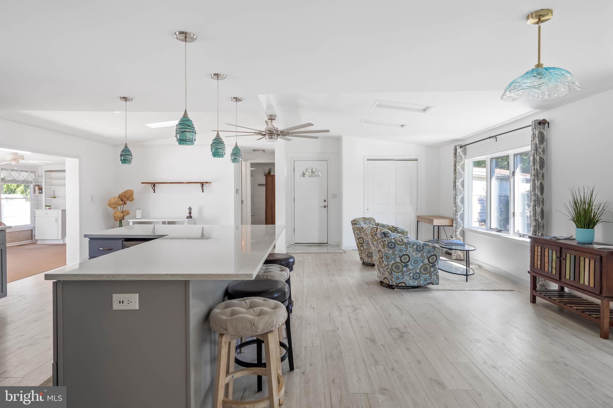 35645 Elk Camp Road Rehoboth Beach, DE 19971 - Photo 15 of 59 a room with furniture and wooden floor