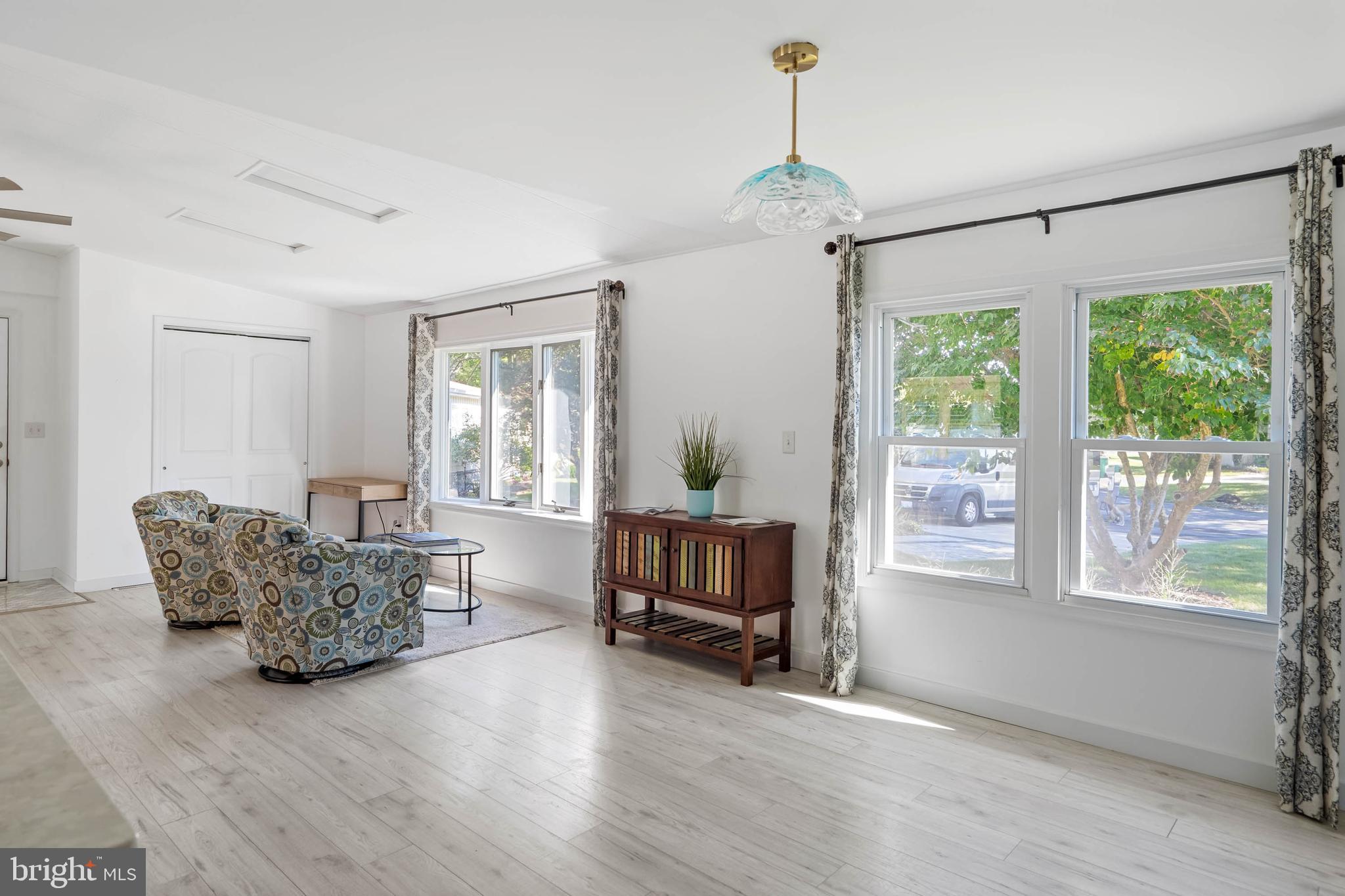 35645 Elk Camp Road Rehoboth Beach, DE 19971 - Photo 16 of 59 a living room with furniture and a window