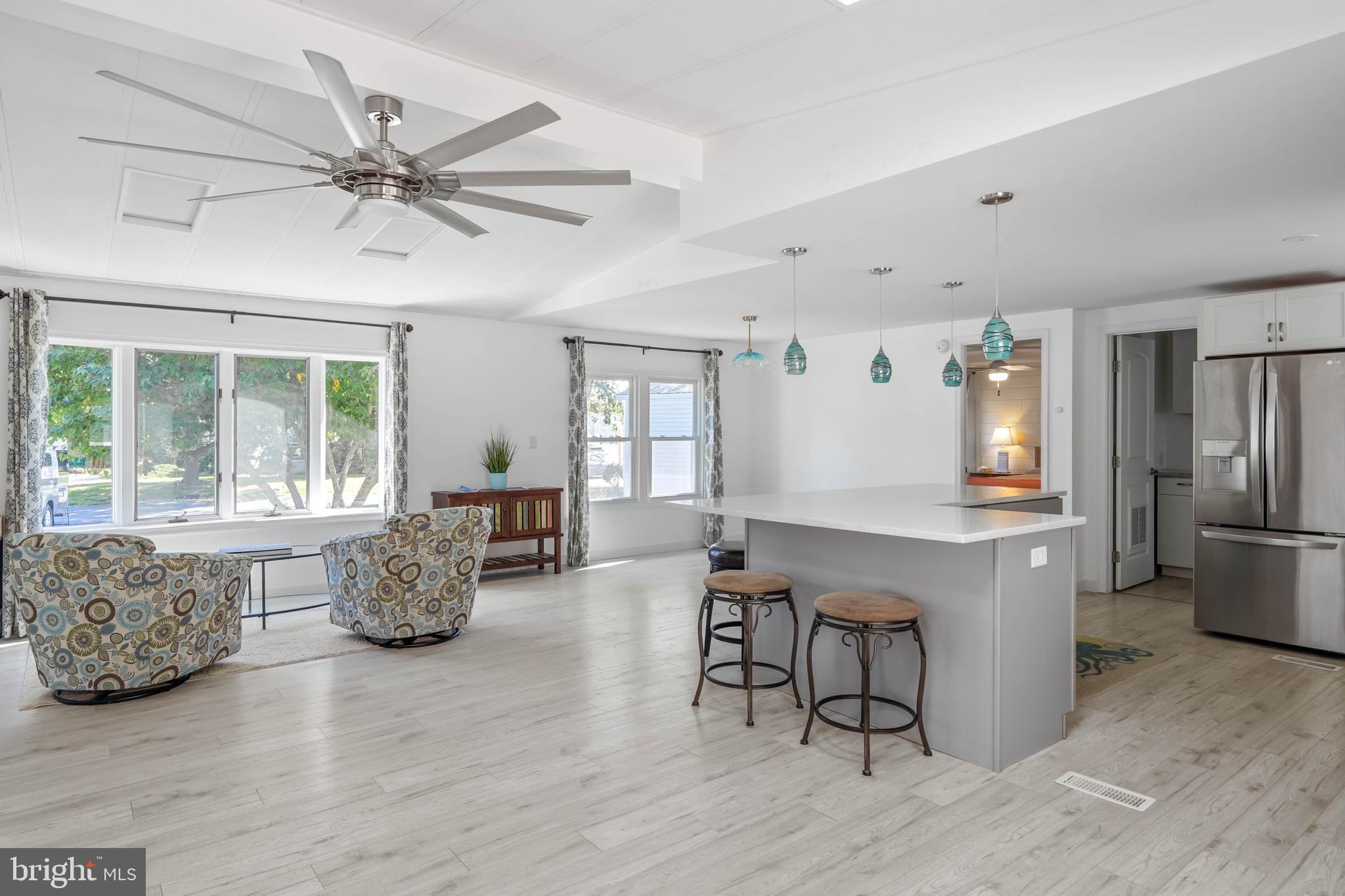 35645 Elk Camp Road Rehoboth Beach, DE 19971 - Photo 18 of 59 a living room with furniture and wooden floor