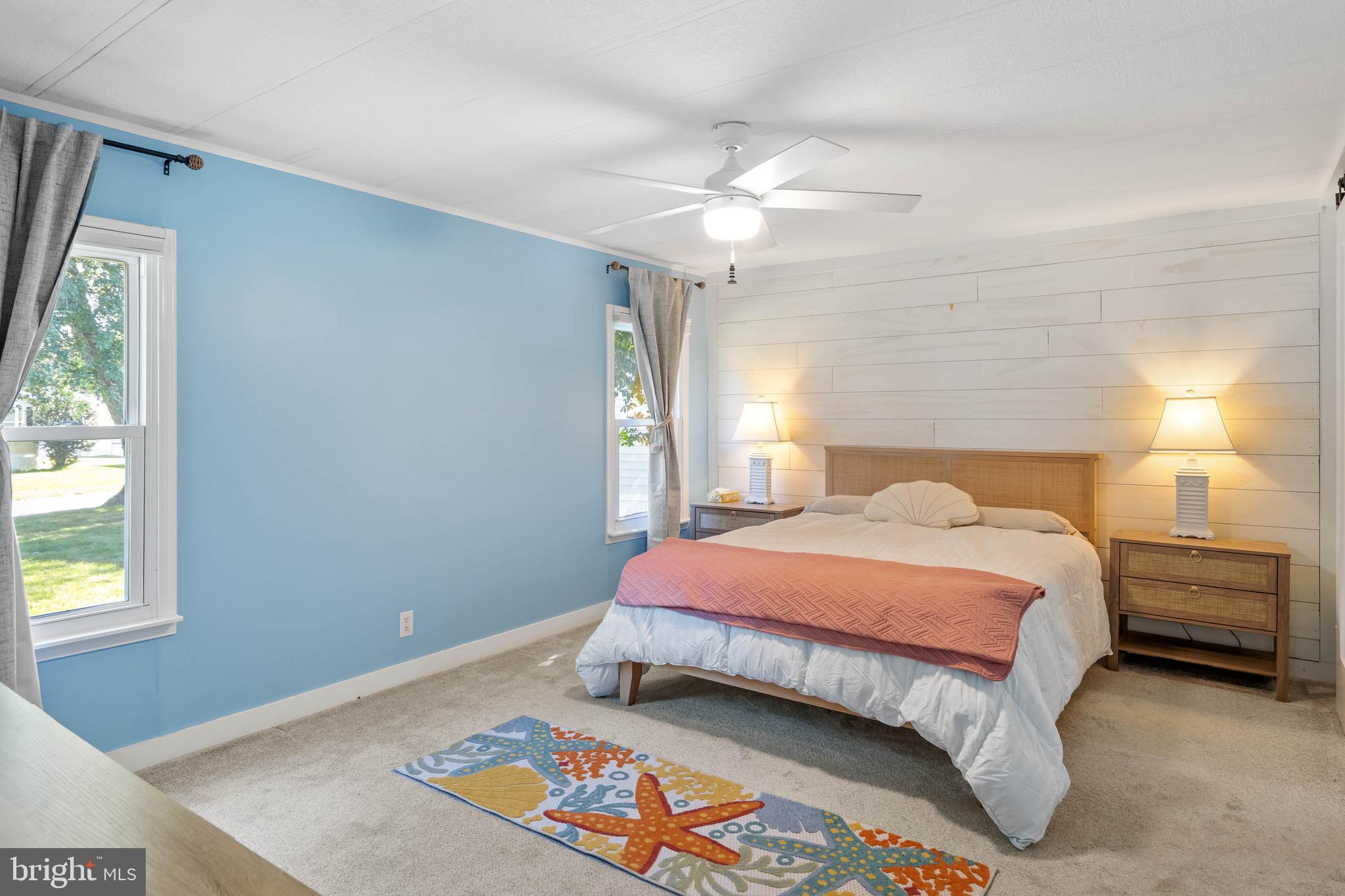 35645 Elk Camp Road Rehoboth Beach, DE 19971 - Photo 24 of 59 a bedroom with a bed and a window