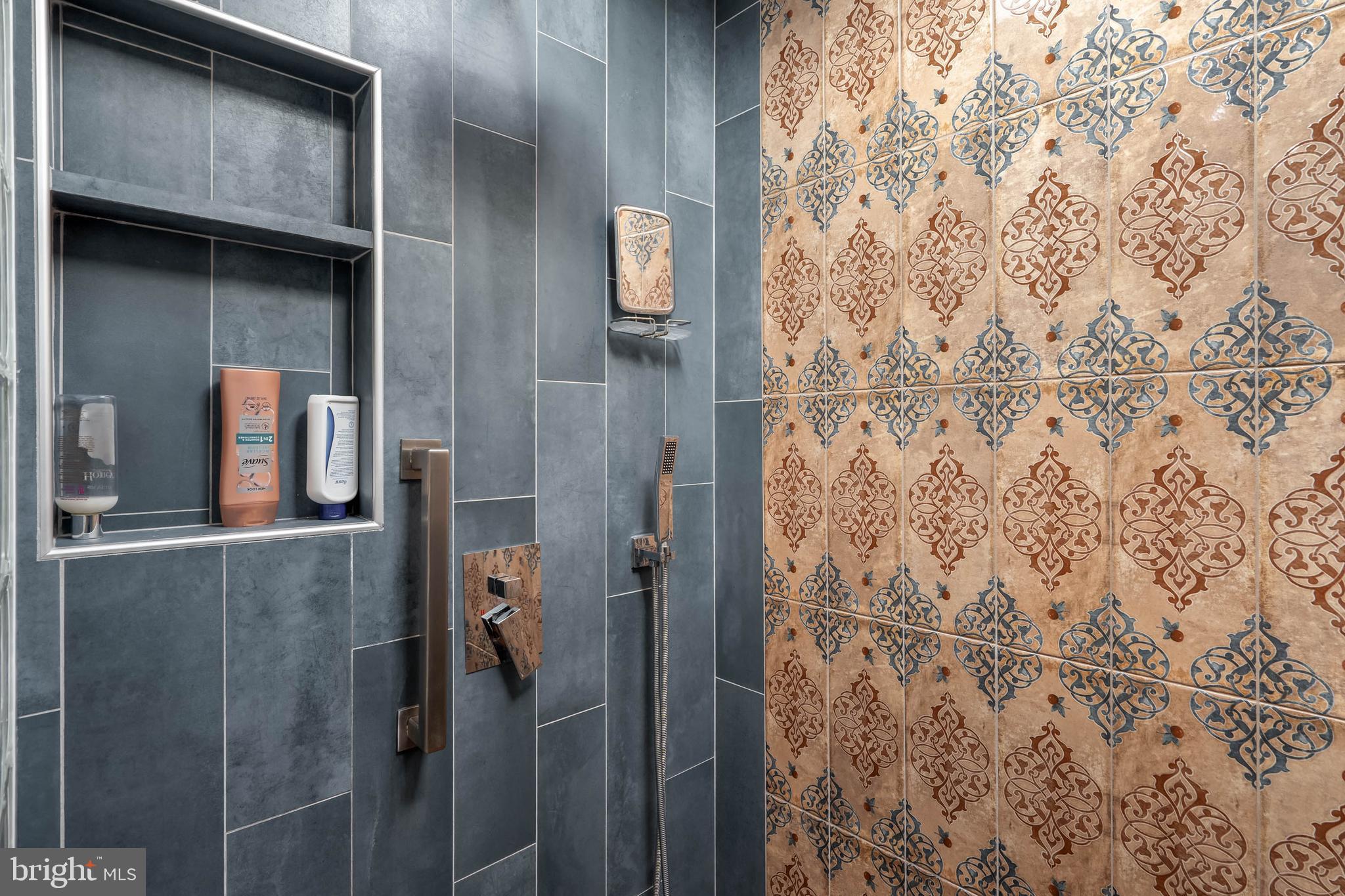 35645 Elk Camp Road Rehoboth Beach, DE 19971 - Photo 34 of 59 a bathroom with a shower and a sink