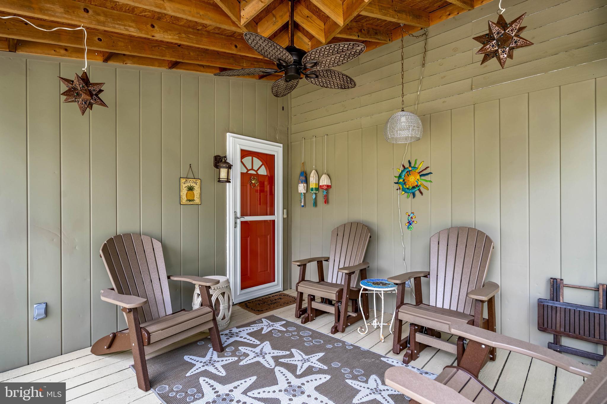 35645 Elk Camp Road Rehoboth Beach, DE 19971 - Photo 4 of 59 a view of livingroom with furniture and a chair