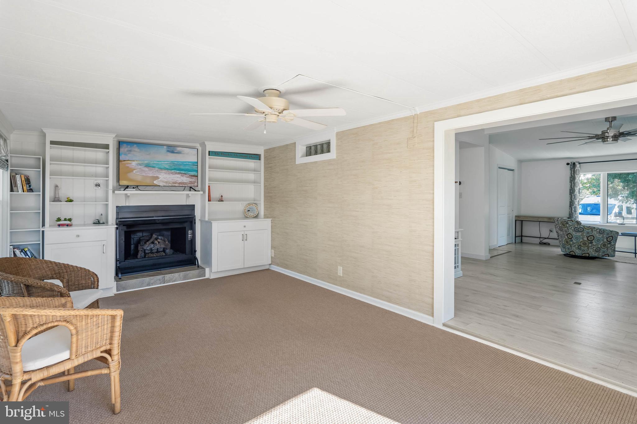 35645 Elk Camp Road Rehoboth Beach, DE 19971 - Photo 41 of 59 a view of a livingroom with furniture and a fireplace