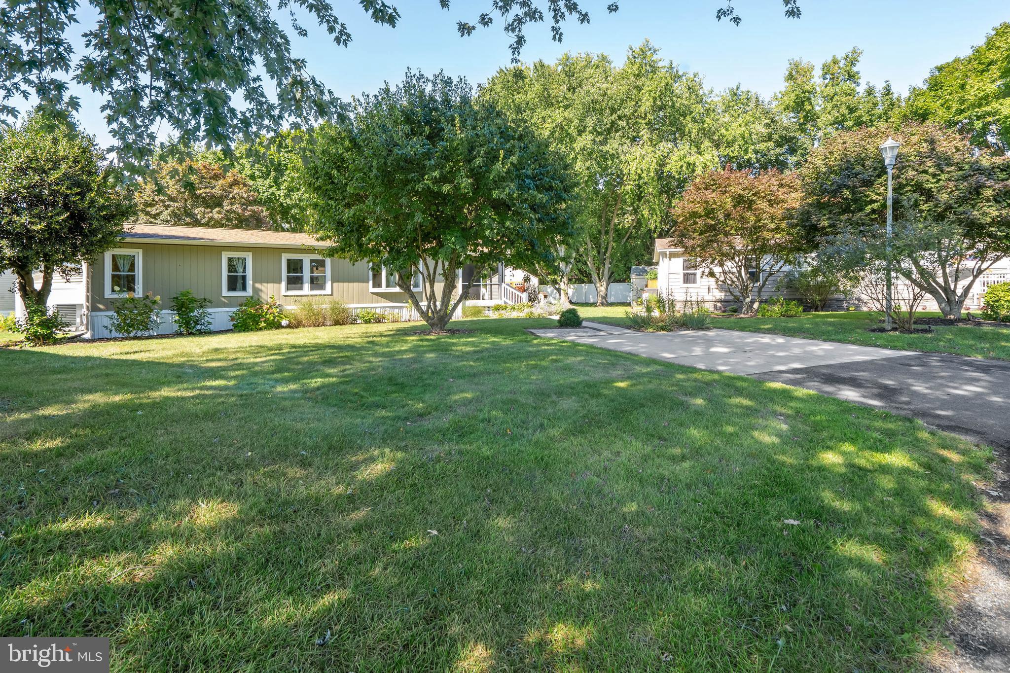 35645 Elk Camp Road Rehoboth Beach, DE 19971 - Photo 47 of 59 a view of a house with a backyard