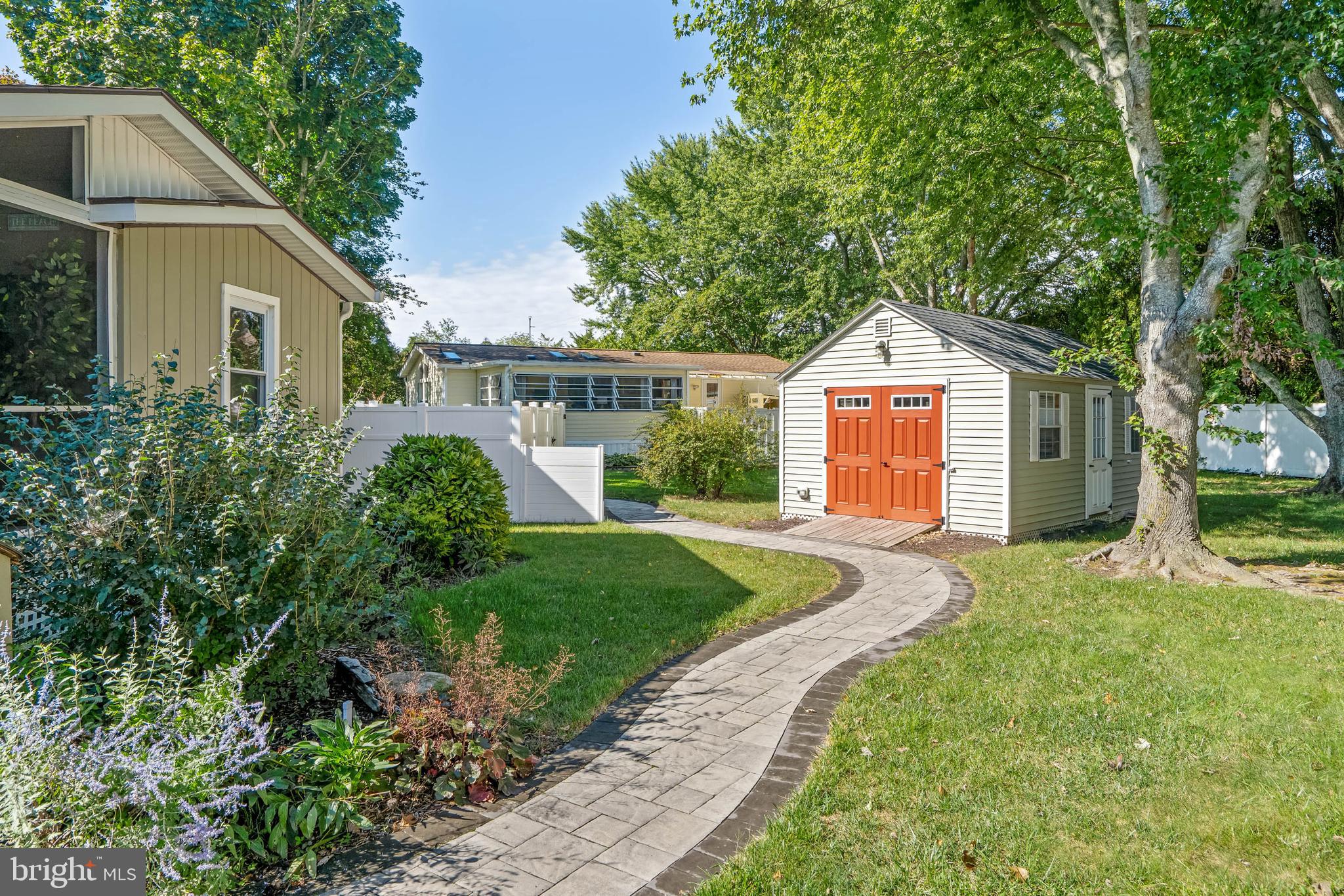 35645 Elk Camp Road Rehoboth Beach, DE 19971 - Photo 50 of 59 a front view of a house with a yard