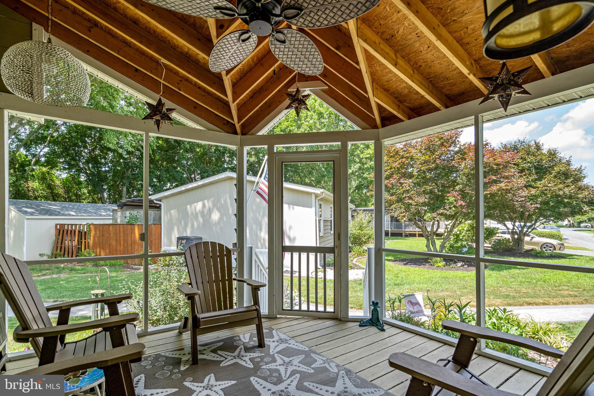 35645 Elk Camp Road Rehoboth Beach, DE 19971 - Photo 5 of 59 a view of a two chairs in the deck