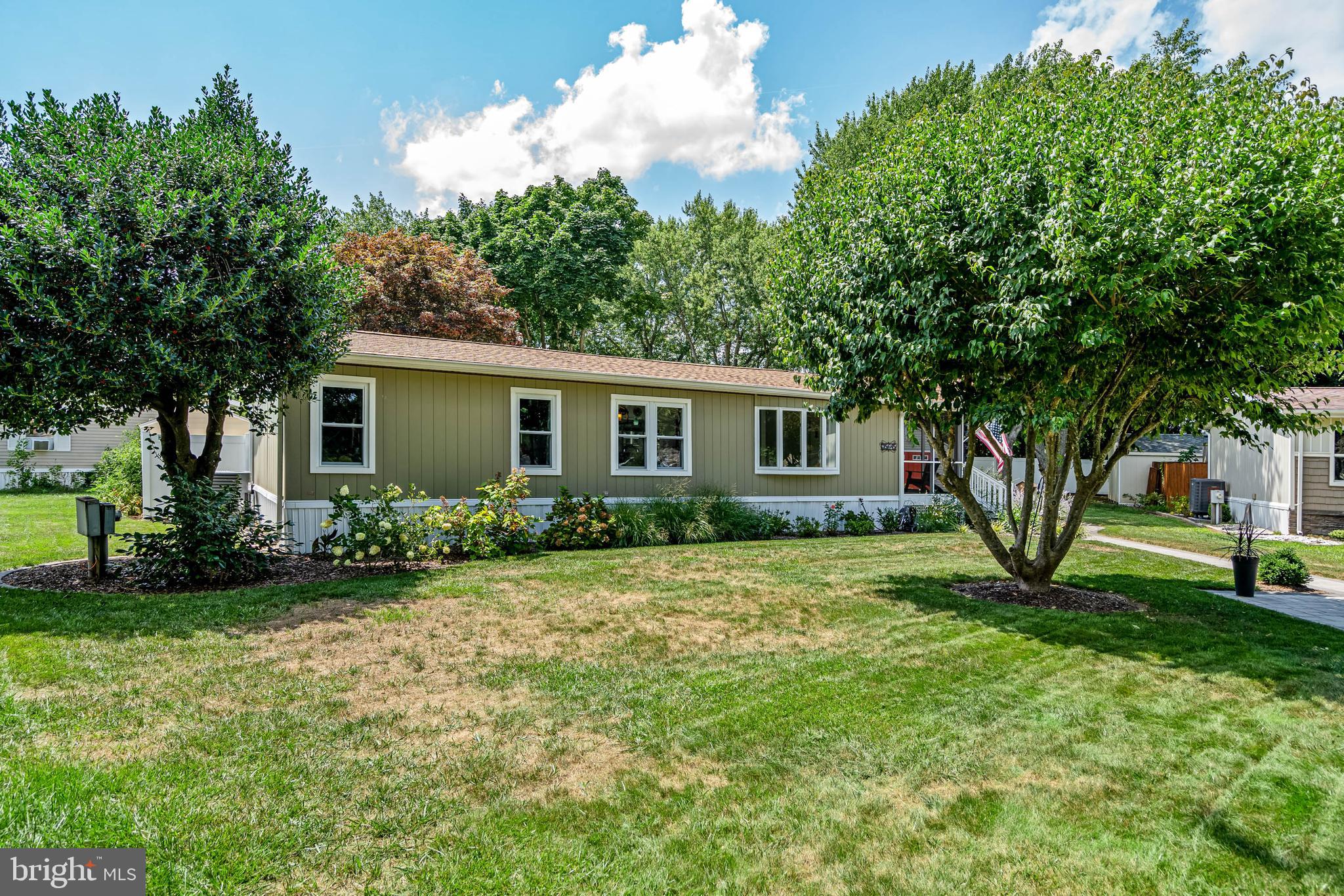 35645 Elk Camp Road Rehoboth Beach, DE 19971 - Photo 54 of 59 a view of a house with backyard and garden
