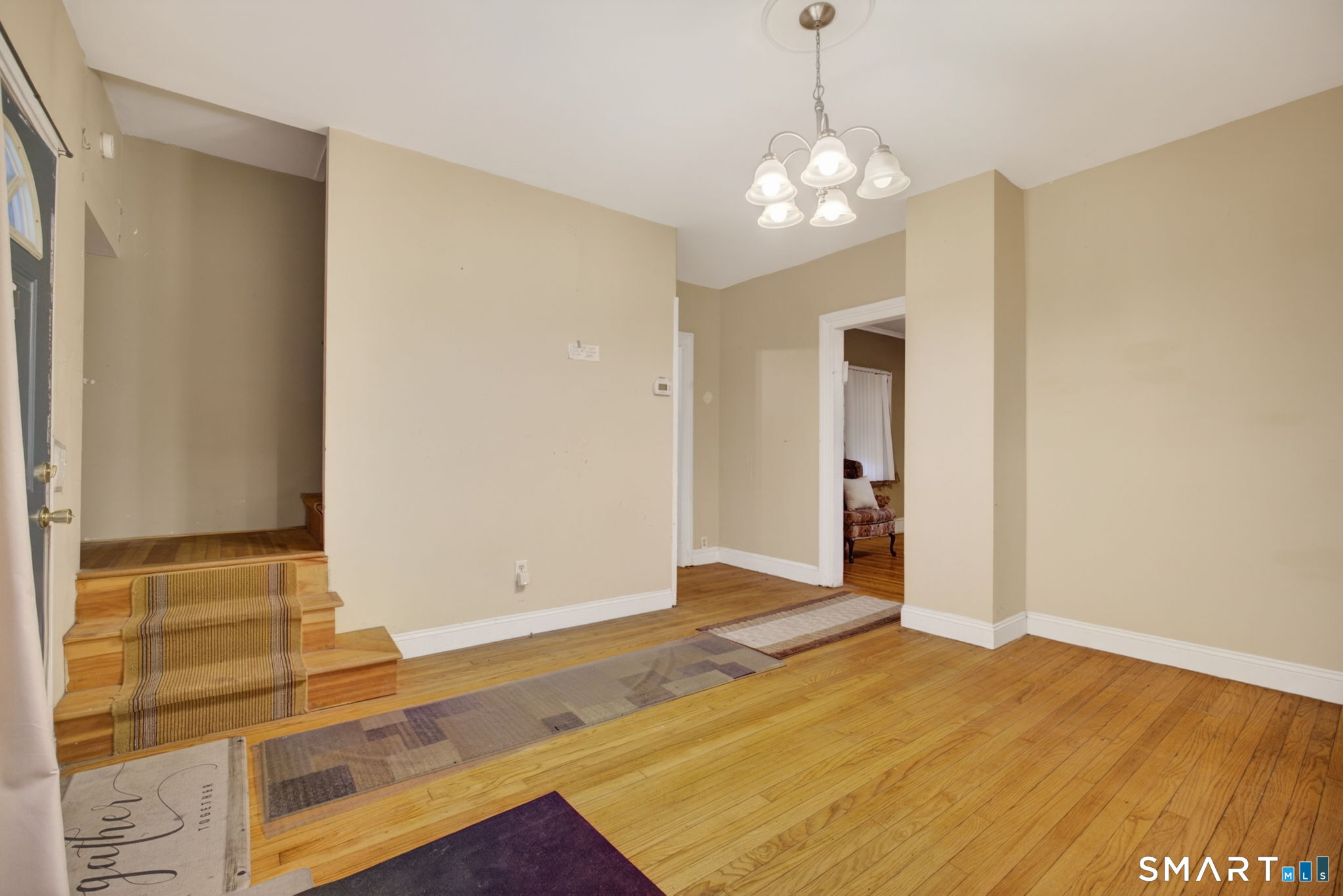 670 Hanover Road Meriden, CT 06451 - Photo 16 of 40 a view of a livingroom with wooden floor and a large window