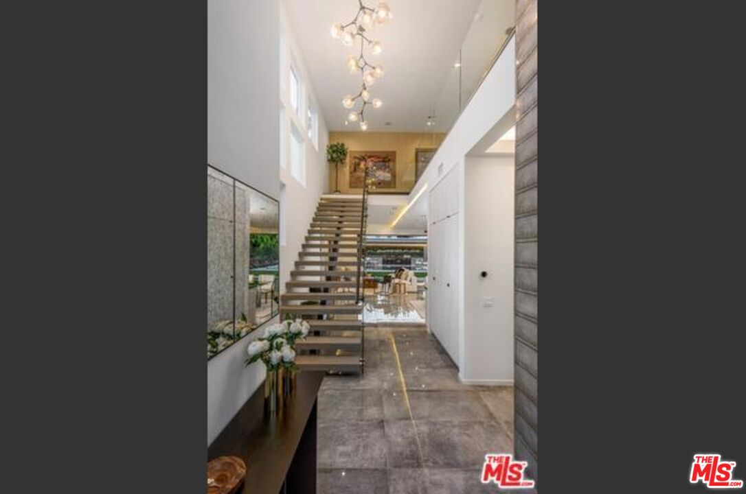 11241 Blix Street Toluca Lake, CA 91602 - Photo 14 of 19 a view of entryway and hall with wooden floor