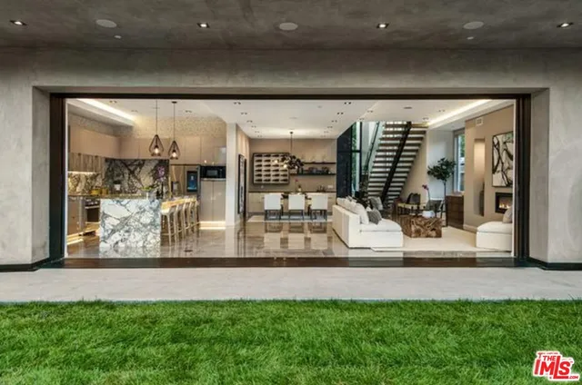 a living room with fireplace furniture and a flat screen tv