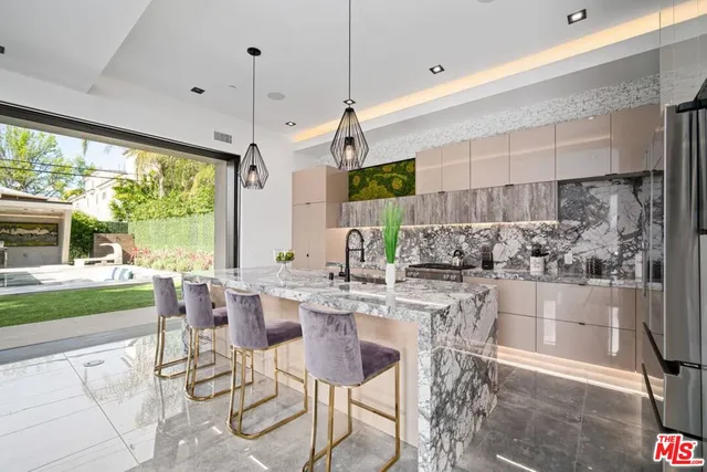a kitchen with a table and chairs