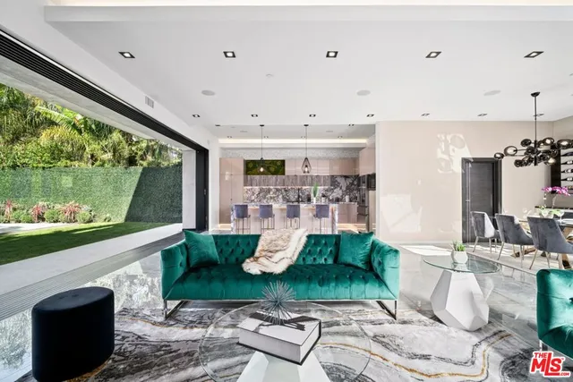 a very nice looking dining room with wooden floor