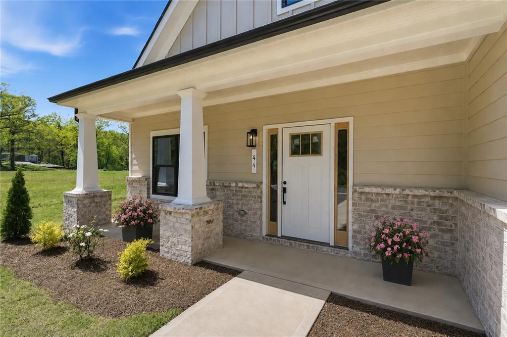 44 Puckett Road Emerson, GA 30137 - Photo 3 of 38 a front view of a house with outdoor seating