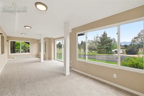 a view of balcony with wooden floor