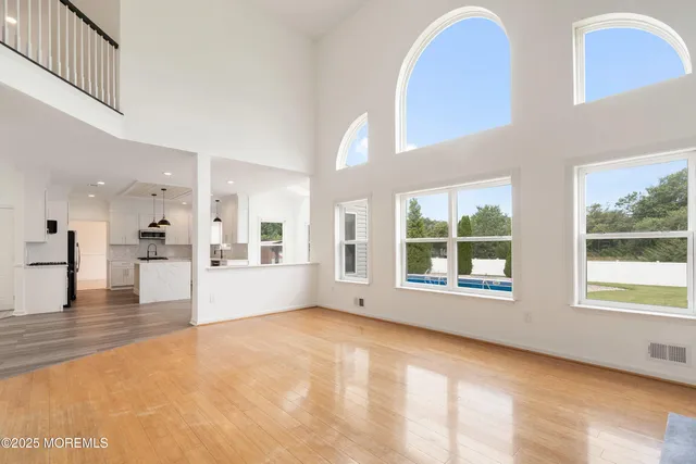 a view of a living room and kitchen with furniture