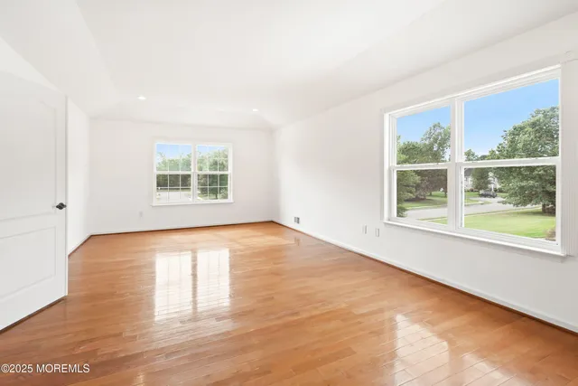a bathroom with a toilet a sink a mirror and bathtub