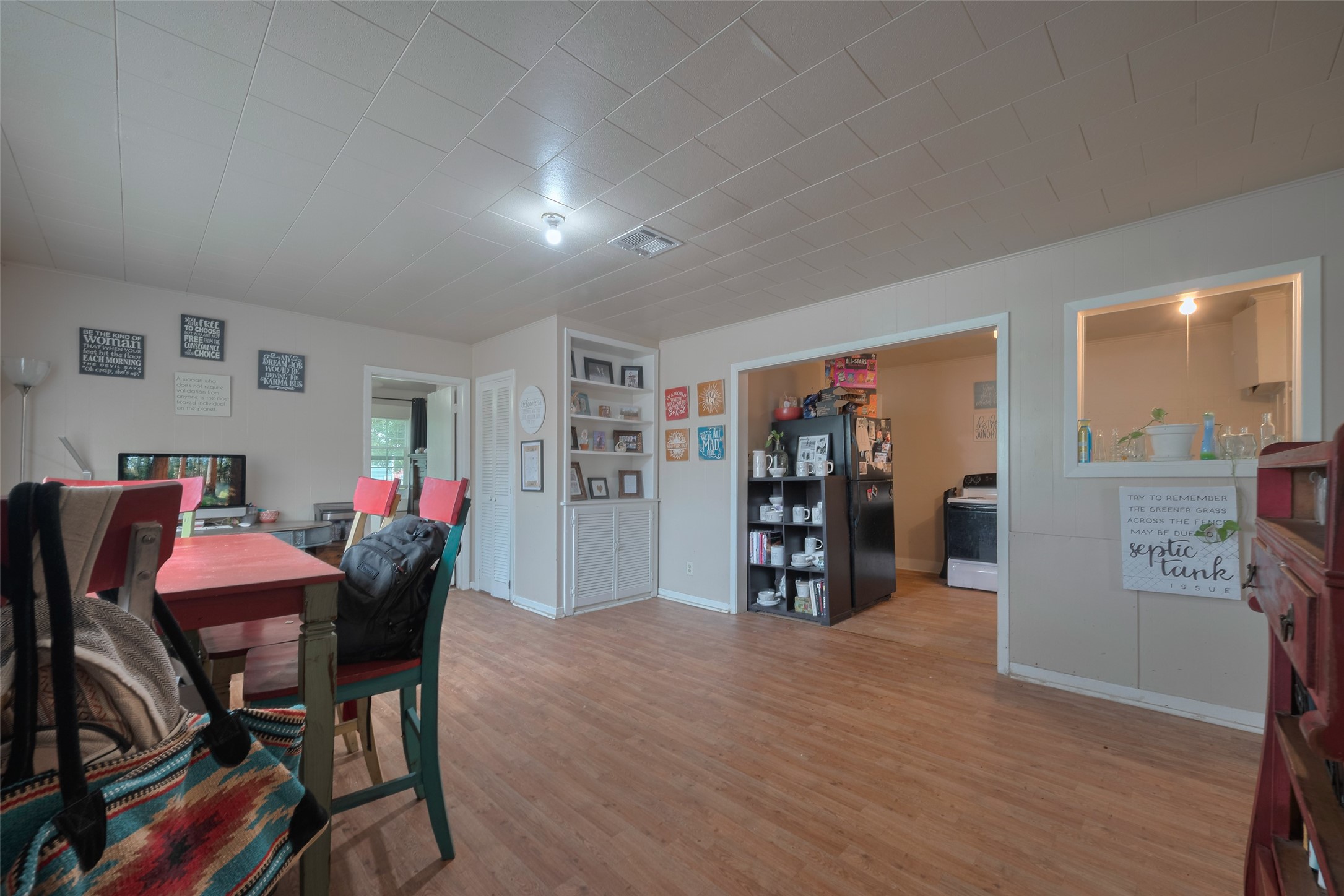 600 Texas Street Wharton, TX 77488 - Photo 14 of 38 a view of a dining room with furniture and wooden floor