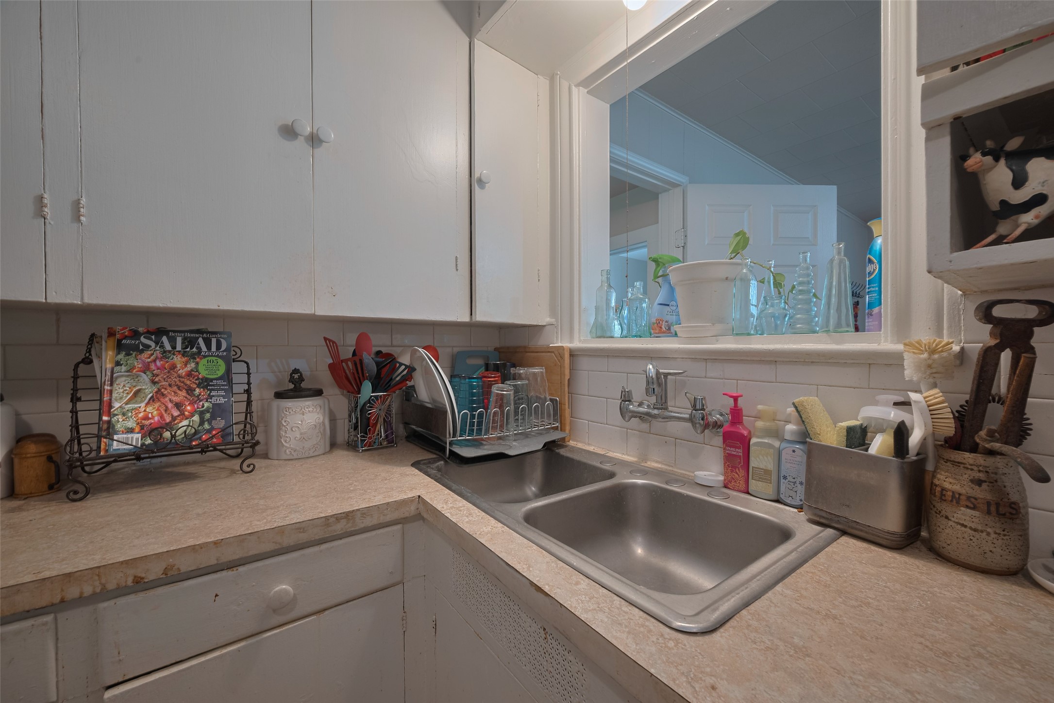 600 Texas Street Wharton, TX 77488 - Photo 22 of 38 a kitchen with sink and cabinets