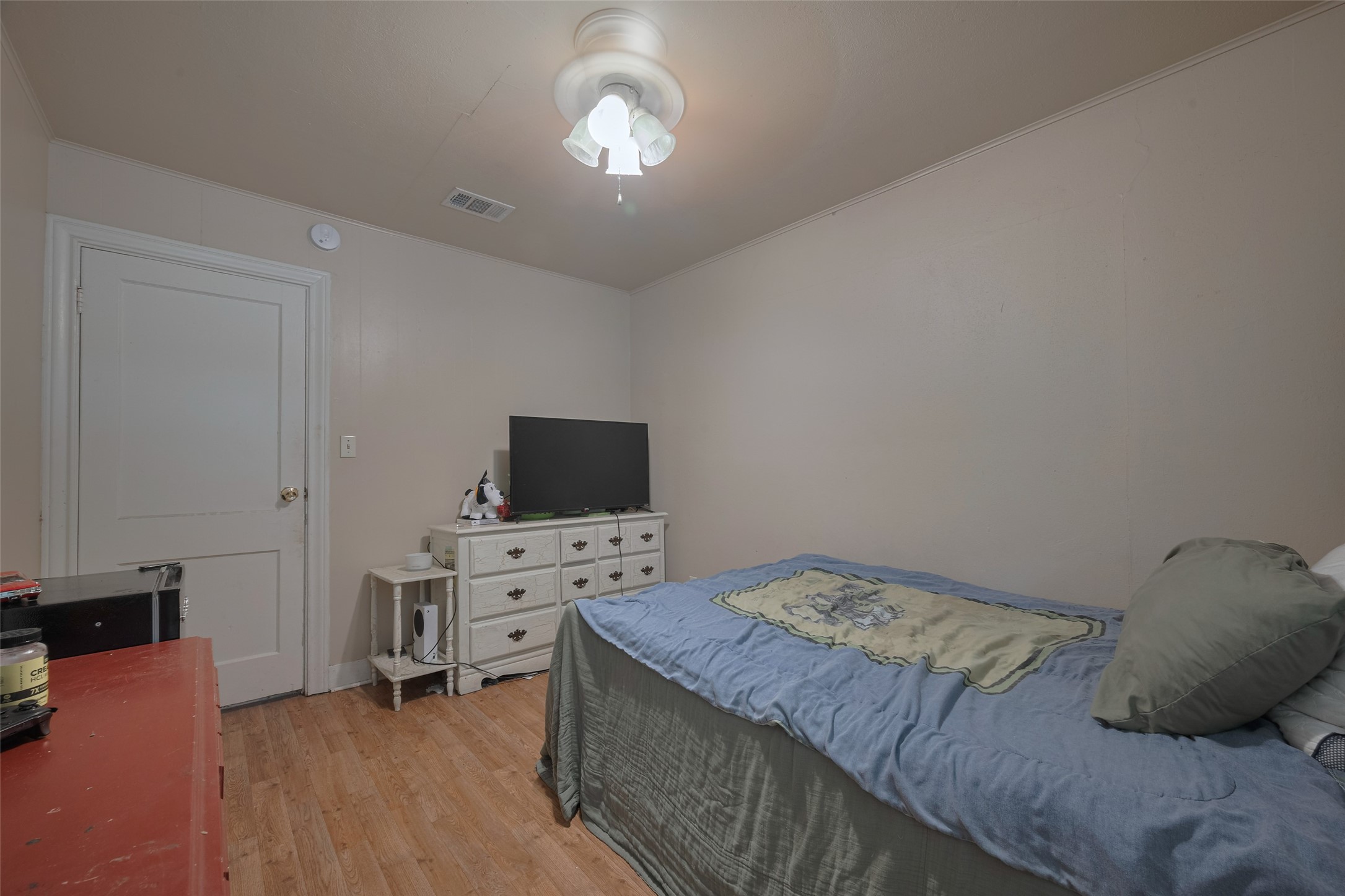 600 Texas Street Wharton, TX 77488 - Photo 27 of 38 a bedroom with a bed and a flat screen tv