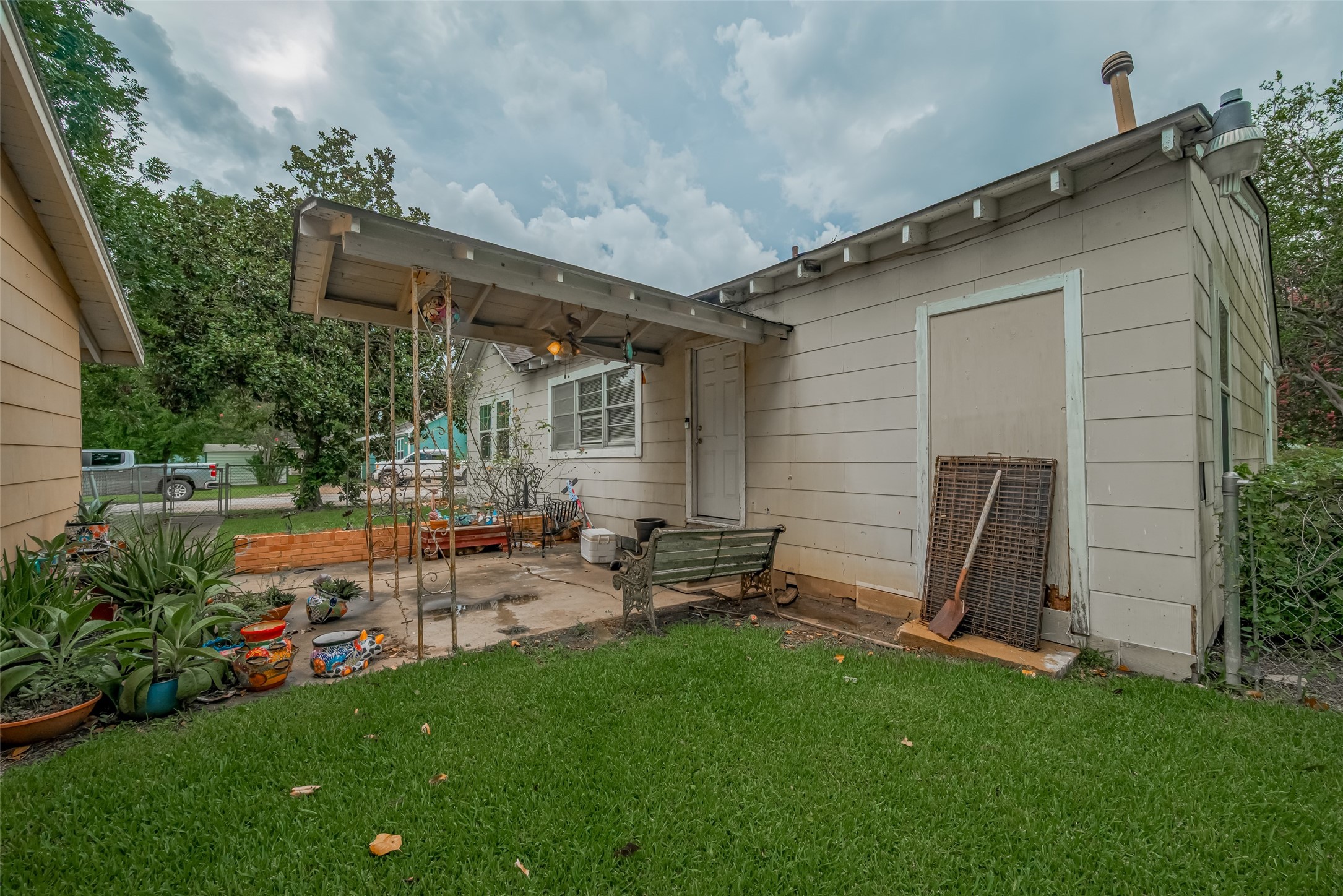 600 Texas Street Wharton, TX 77488 - Photo 36 of 38 a view of backyard of house with outdoor seating and green space