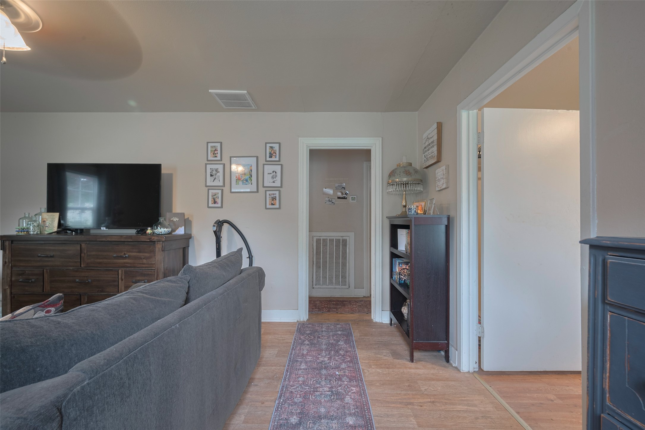 600 Texas Street Wharton, TX 77488 - Photo 9 of 38 a living room with furniture and a flat screen tv
