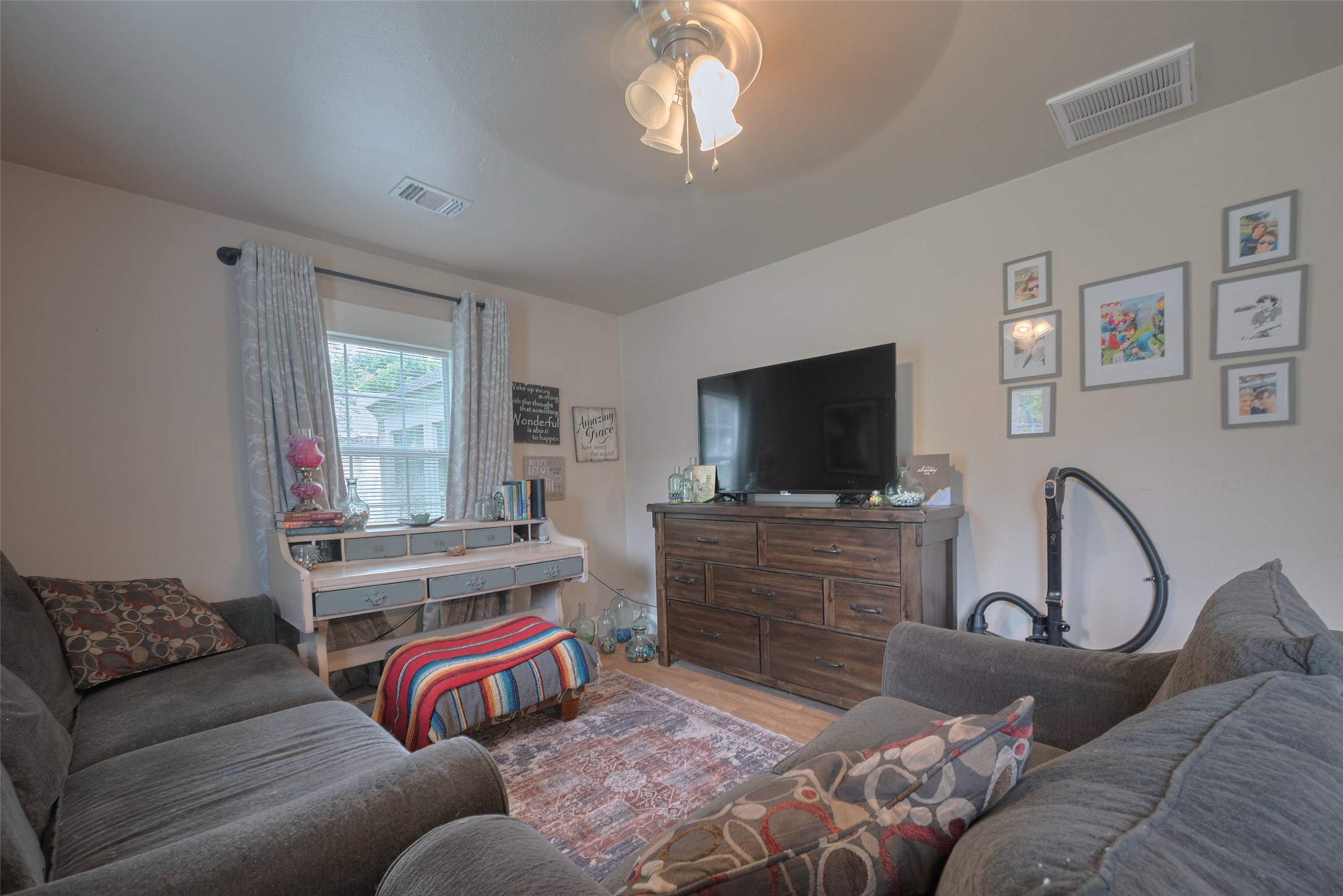 600 Texas Street Wharton, TX 77488 - Photo 10 of 38 a living room with furniture and a flat screen tv