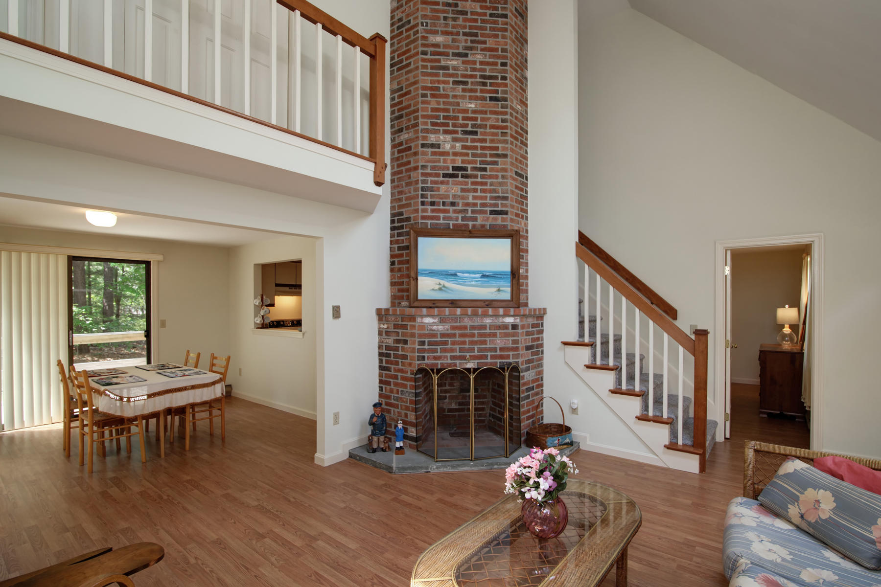 69 Nobadeer Road Centerville, MA 02632 - Photo 3 of 14 a living room with furniture and a fireplace