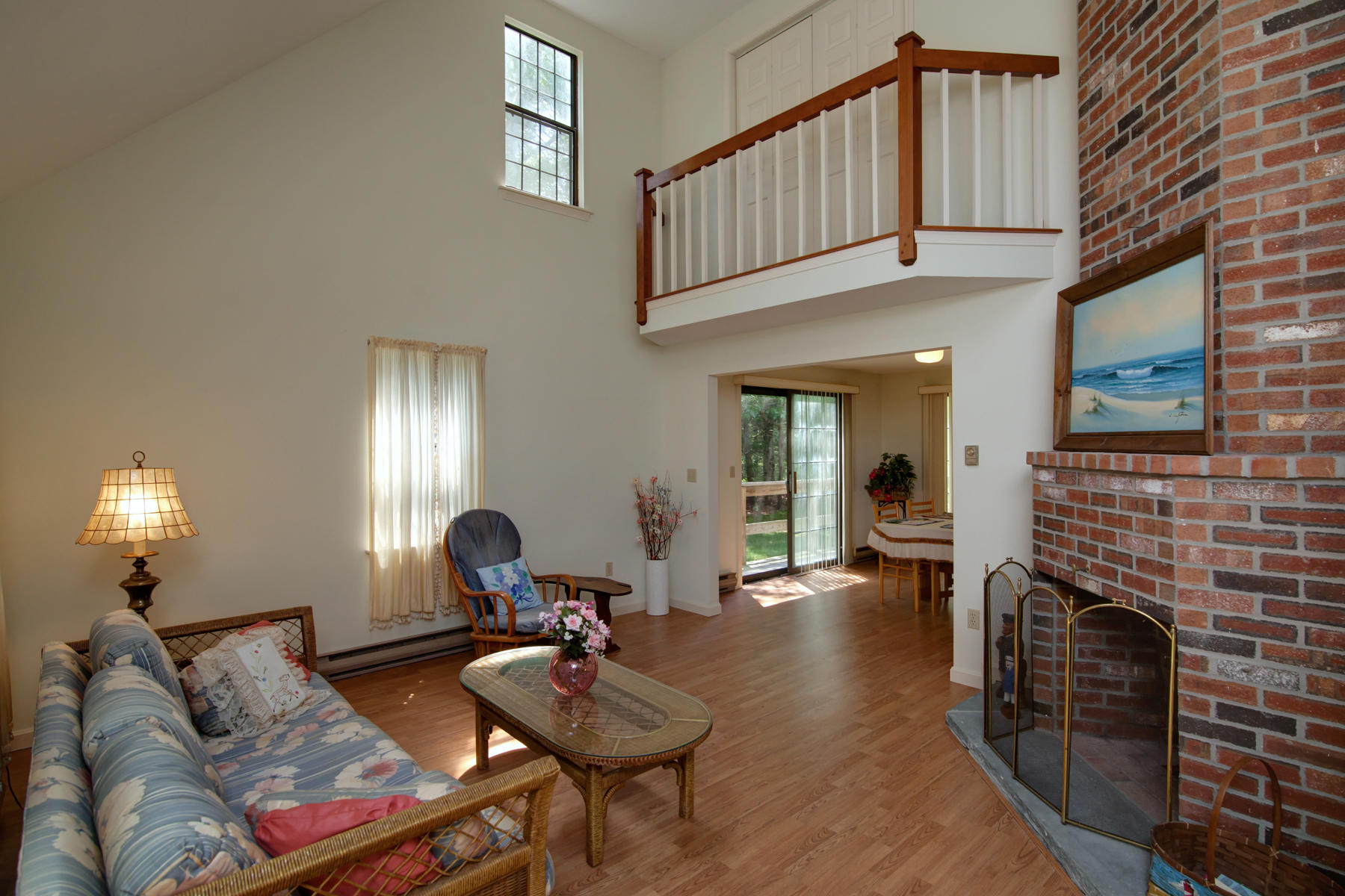 69 Nobadeer Road Centerville, MA 02632 - Photo 4 of 14 a living room with furniture a fireplace and a flat screen tv