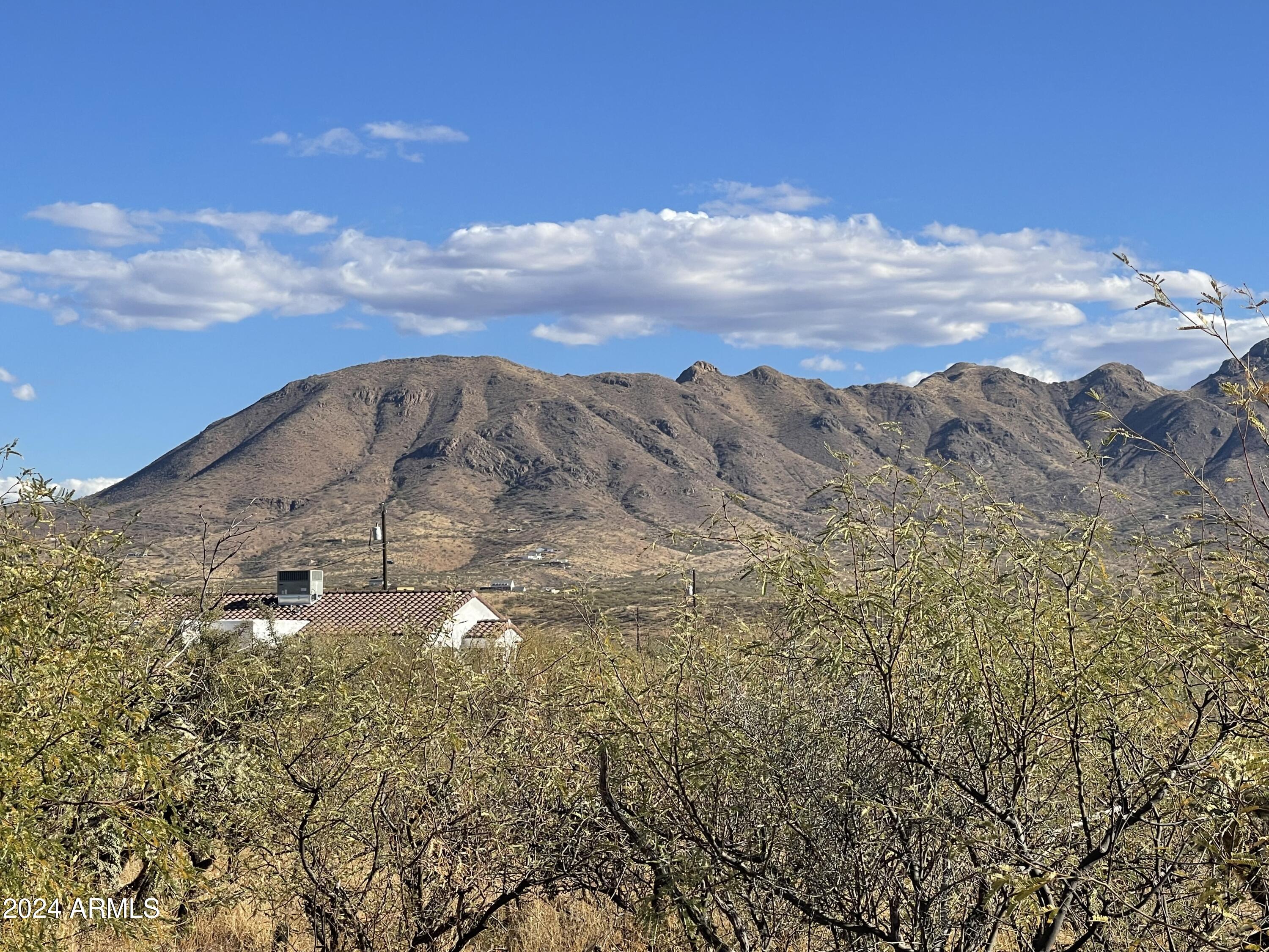 80 Paseo Australia, Unit 11 Rio Rico, AZ 85648 - Photo 5 of 7 a view of a lake with mountains in the background
