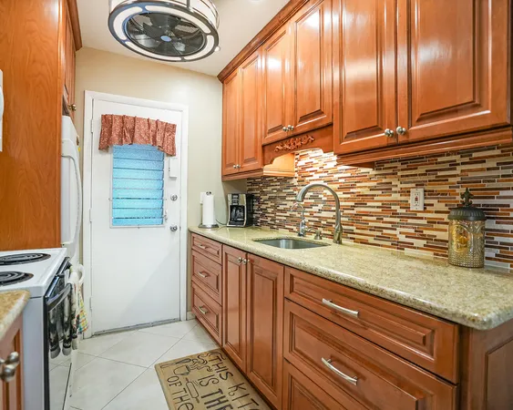 a kitchen with a sink and a stove