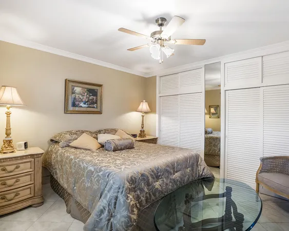 a bedroom with a bed dresser and a window