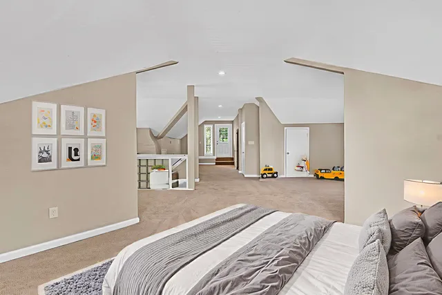 a bedroom with a bed and a couch